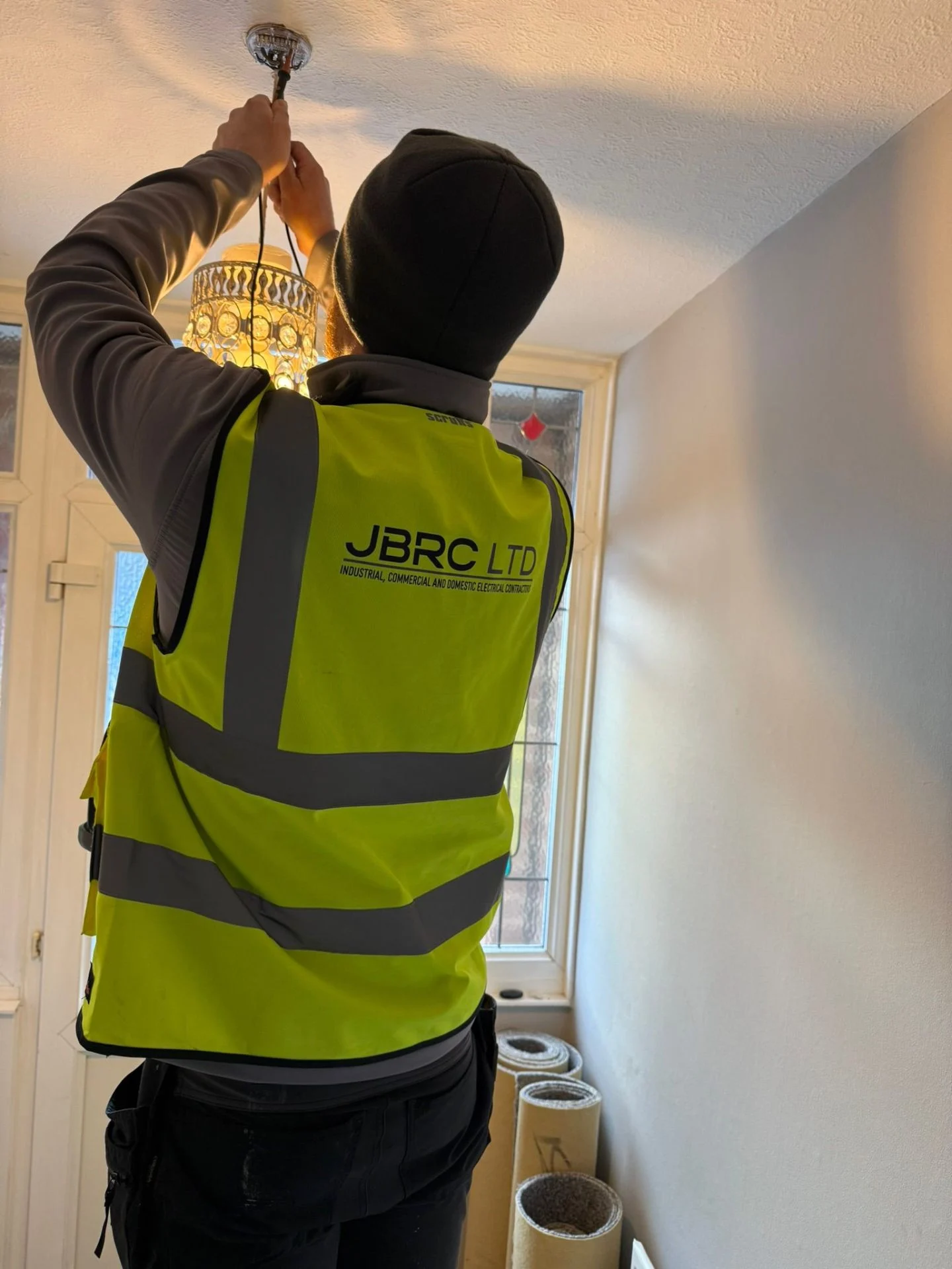 JBRC NICEIC electrician installing a ceiling pendant light during a landlord EICR in a Nottingham rental property