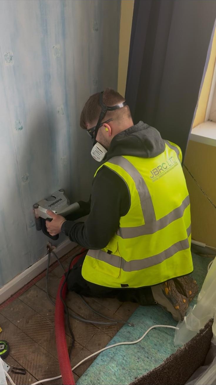 First-fix rewire in progress on a Nottingham semi-detached home, with new twin-and-earth cabling clipped through joists